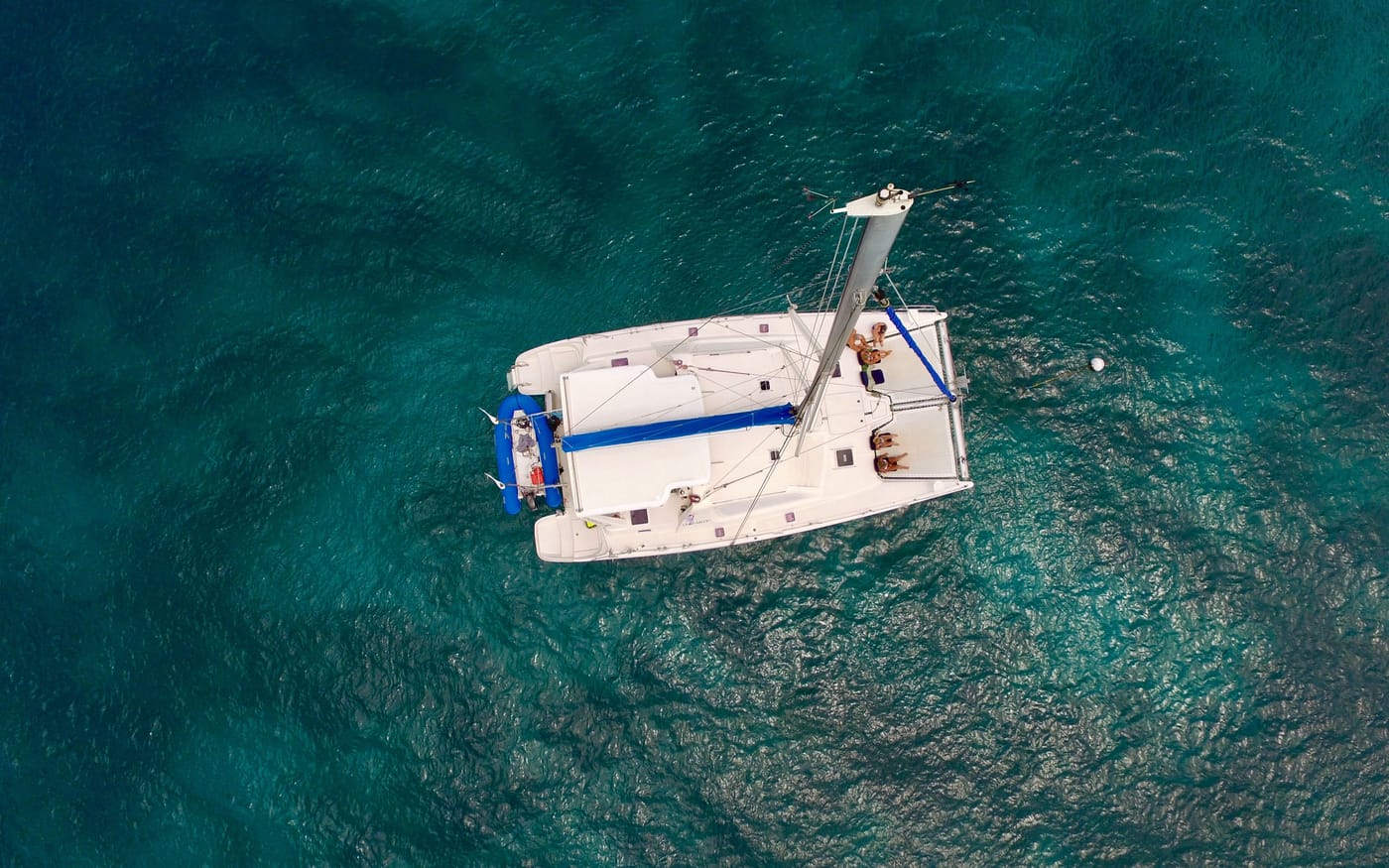 Calabaza seen from above, alone on deep turquoise water