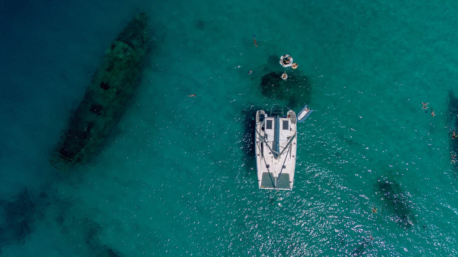 Calabaza from above, anchored beside a shipwreck in clear water